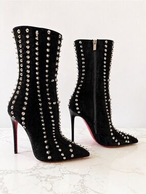 Christian Louboutin spike boots 
Black Studded Pointed-Toe Stiletto Boot